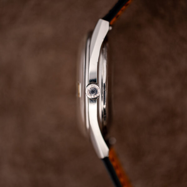 Crown side of the Longines Conquest 7171-5 case in profile, with the signed crown and crystal