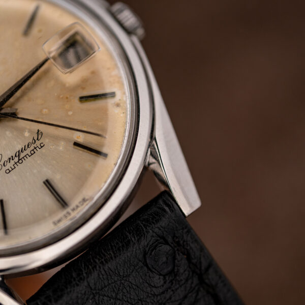 Close view of a lower lug and dial edge on the Longines Conquest 7171-5