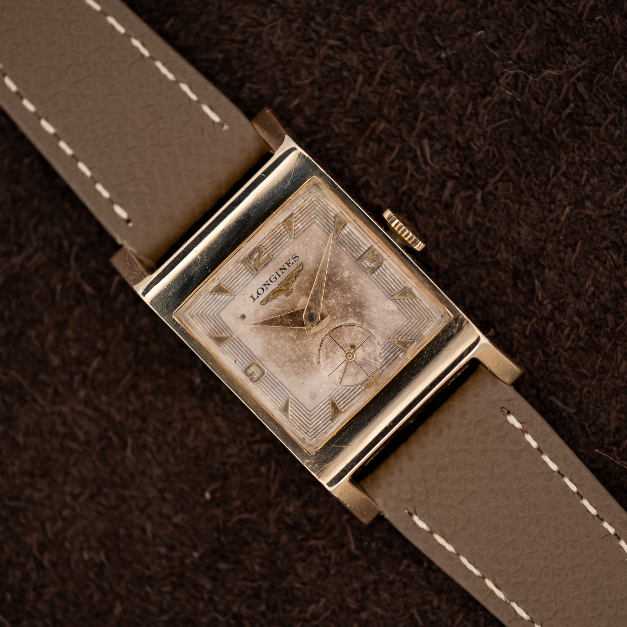 DSCF8453 Longines Tank 2172-10 at an angle, showing the stepped-line rectangular dial, small seconds and taupe strap