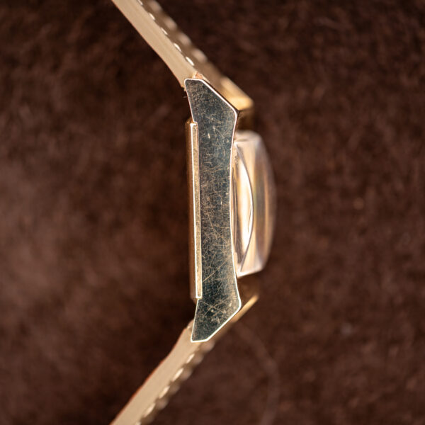 Longines Art Deco tank side profile with curved lugs, caseback seam and raised crystal