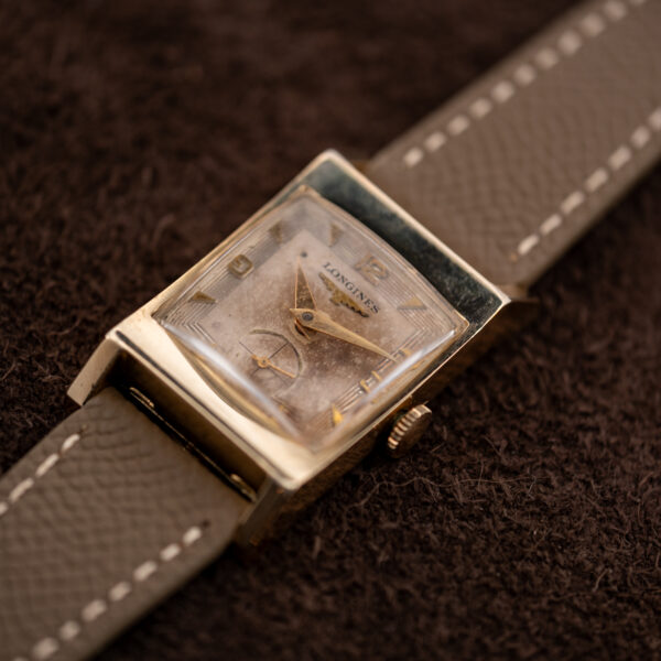 Low angled front of the vintage Longines 2172-10 with stepped-line dial, triangular markers and small seconds