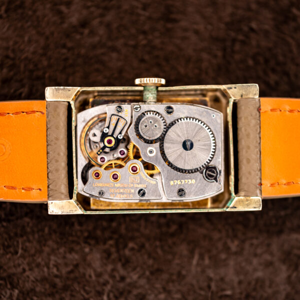 Open Longines 2172-10 case showing the signed caliber 9LT manual-wind movement and its serial stamp