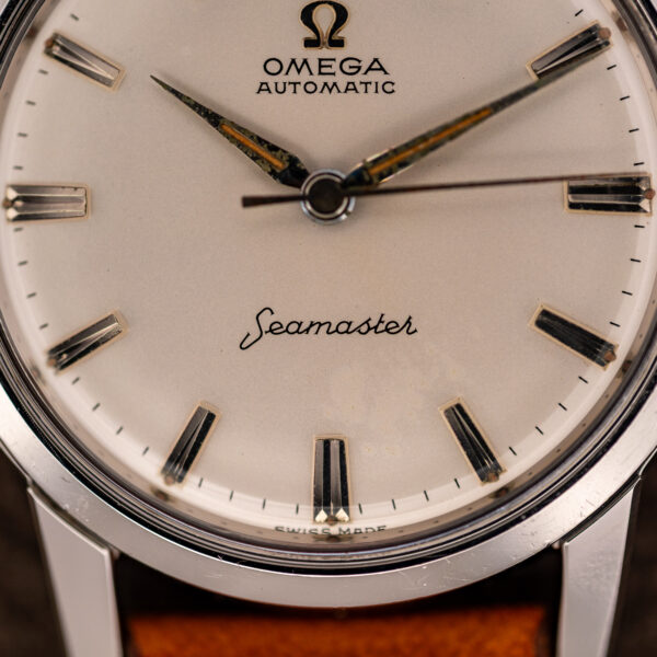 Lower dial close-up of the Omega Seamaster 14704 showing Seamaster script, faceted batons and SWISS MADE
