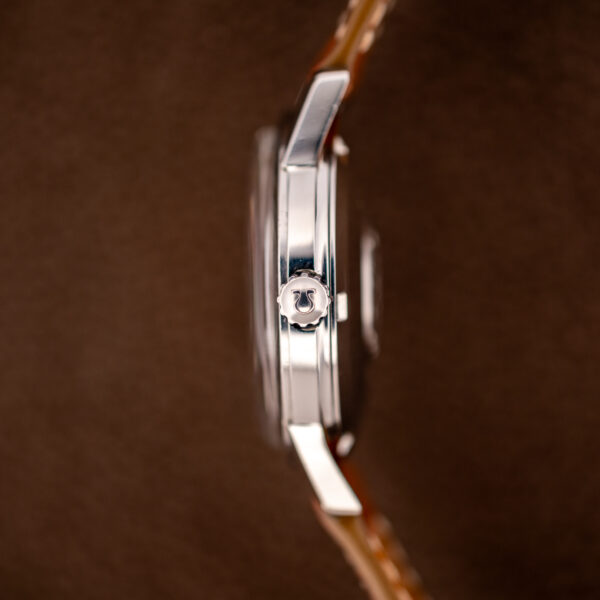 Crown-side profile of the steel Omega Seamaster case with Omega-marked crown and straight case flank