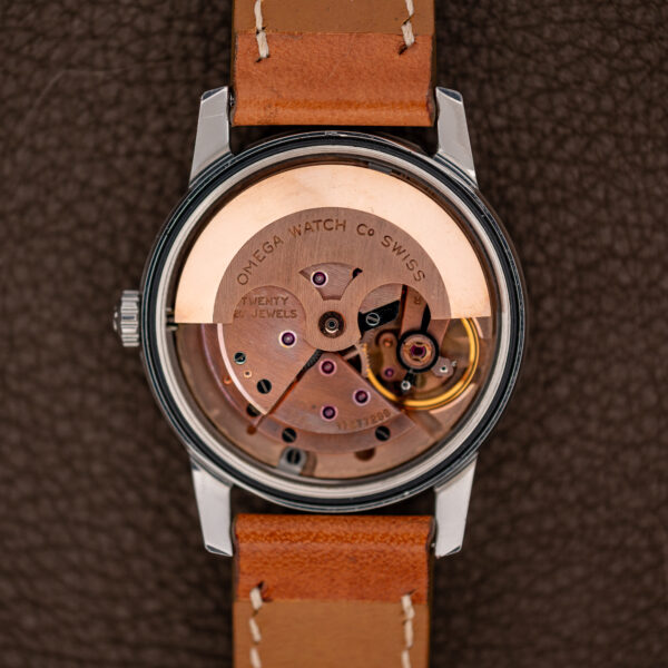 Open case of the Omega Seamaster 14704 showing the caliber 591 automatic movement and its rotor