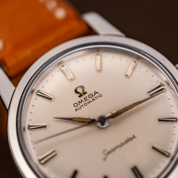 Oblique dial close-up of the 1961 Omega Seamaster 14704 with applied Omega symbol and Automatic text