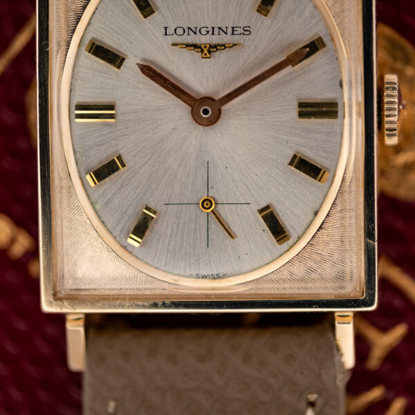Lower dial of the Longines tank showing crosshair small seconds at six and the SWISS signature