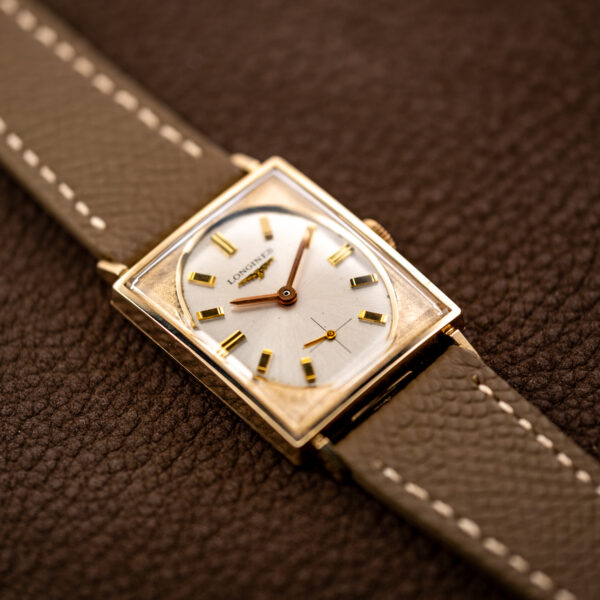 Longines 1137-370 front at an angle, showing the textured surround around the oval baton-marker dial