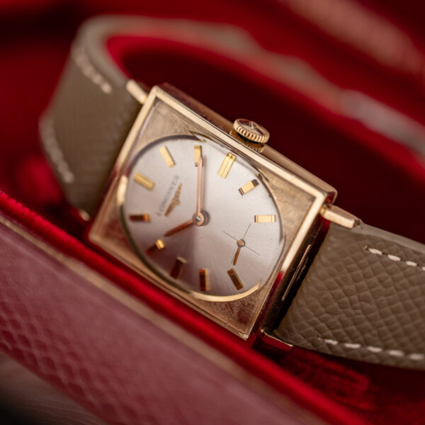 Longines 1137 tank resting inside an open red Longines presentation box, with dial and crown visible